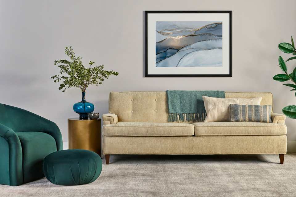 plush gray patterned carpet in living room with green velvet accents